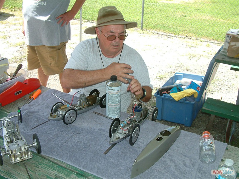 Bob Oge preps his cars for the day's running July 9-10