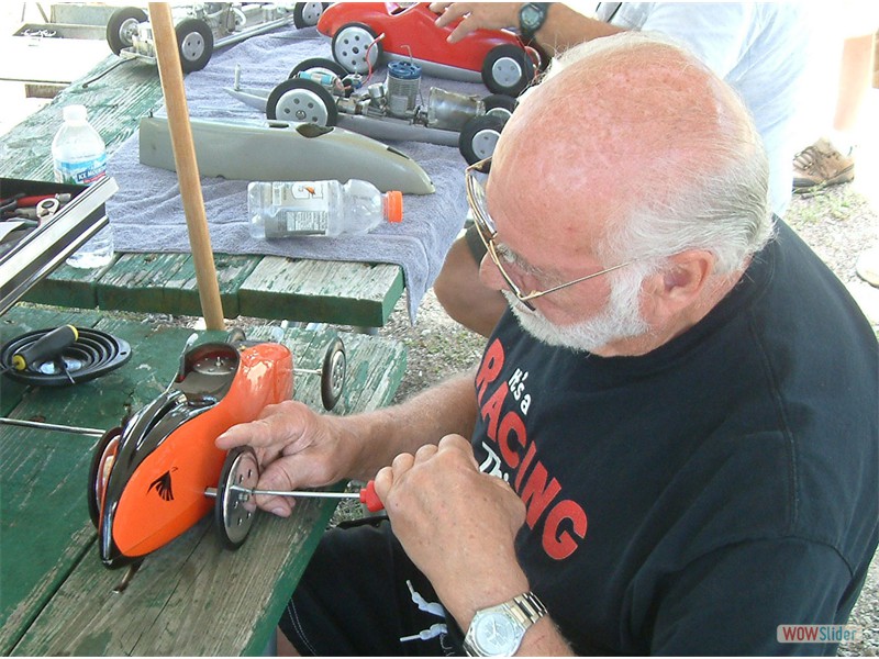 Ron Hesskamp tightens the wheel screws on his Ellis Car July 9-10